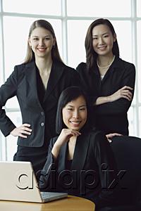 AsiaPix - Three businesswomen, smiling at camera, portrait