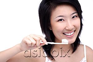 AsiaPix - Young woman with toothbrush