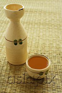 AsiaPix - Ceramic bottle and cup with tea
