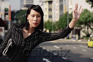 AsiaPix - Businesswoman hailing a cab