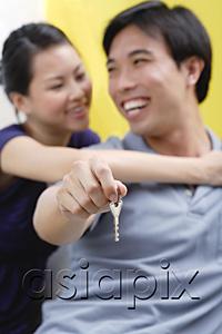 AsiaPix - Couple embracing, man holding keys,