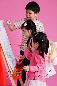 AsiaPix - Three children painting on easel