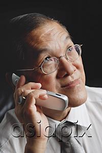 AsiaPix - Senior man using mobile phone