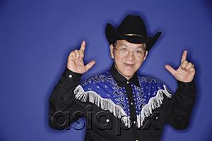 AsiaPix - Senior man dressed in cowboy attire