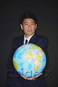 AsiaPix - Businessman holding globe