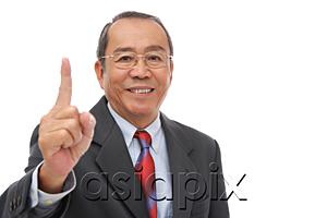AsiaPix - Businessman looking at camera, raising finger