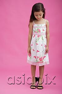 AsiaPix - Young girl wearing high heel shoes, looking down