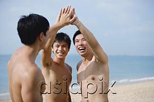 AsiaPix - Three men on beach, putting hands together