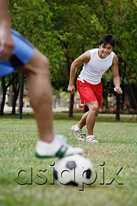 AsiaPix - Two men playing soccer