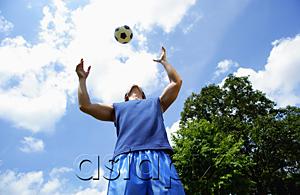 AsiaPix - Man catching soccer ball