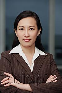 AsiaPix - Businesswoman with arms crossed, portrait