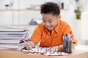 AsiaPix - Boy doing homework
