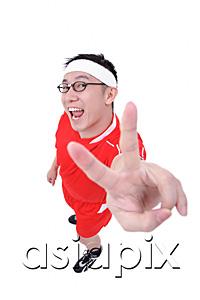 AsiaPix - Man in soccer uniform making peace sign