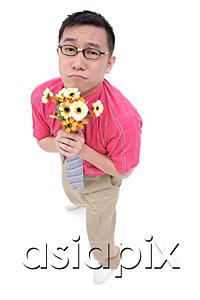 AsiaPix - Man in shirt and tie holding flower bouquet, frowning