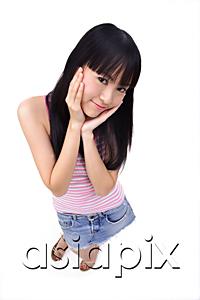 AsiaPix - Young woman with hands on face, smiling at camera