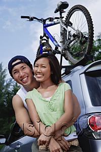 AsiaPix - Couple standing next to SUV, portrait
