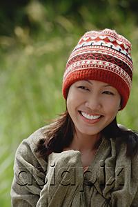 AsiaPix - Woman with ski cap, wrapped in a blanket, head shot