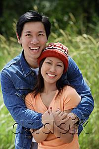 AsiaPix - Couple embracing, smiling at camera