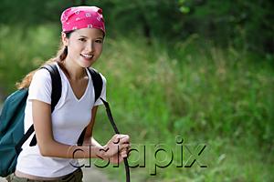 AsiaPix - Female hiker smiling at camera