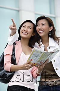 AsiaPix - Two young women with map, looking up