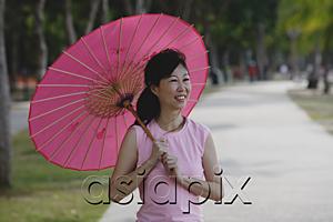 AsiaPix - Mature woman using pink umbrella