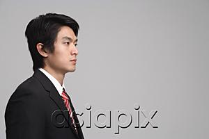 AsiaPix - Businessman looking away, studio shot