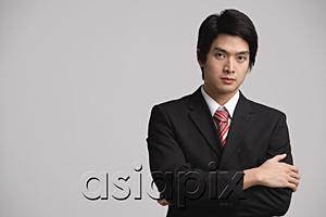 AsiaPix - Businessman looking at camera, arms crossed
