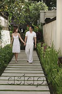 AsiaPix - Couple walking along path in garden, holding hands