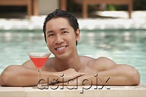 AsiaPix - Man in swimming pool, leaning on the edge