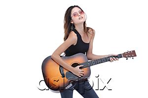 AsiaPix - Young woman playing guitar