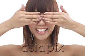AsiaPix - Young woman with hands covering eyes
