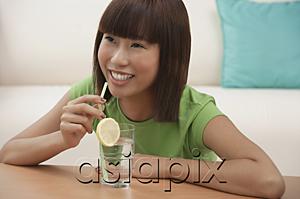 AsiaPix - Young woman with a glass of water