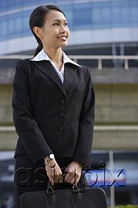AsiaPix - Businesswoman with briefcase, looking away