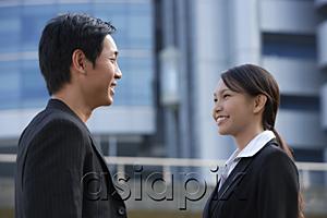 AsiaPix - Businesswoman and businessman talking