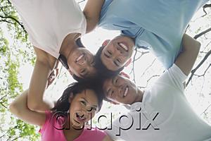 AsiaPix - Young adults with arms around each other, looking down at camera