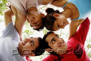 PictureIndia - Circle of friends, arms around each other, looking away