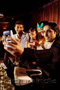 PictureIndia - Couples at bar, taking picture with mobile phone camera