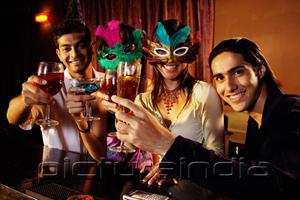 PictureIndia - Couples at bar, holding drinks, looking at camera