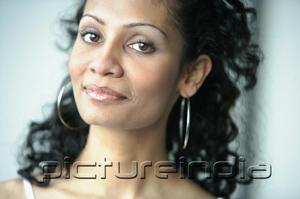 PictureIndia - Woman looking at camera, smiling
