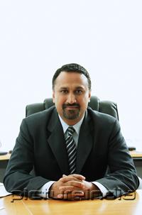 PictureIndia - Businessman sitting at desk