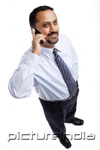 PictureIndia - Businessman using mobile phone