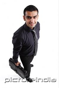 PictureIndia - Executive carrying briefcase