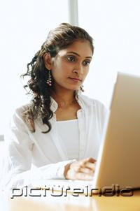 PictureIndia - Woman using laptop