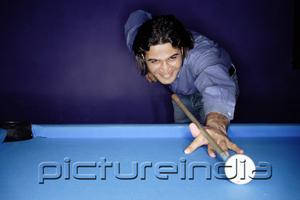 PictureIndia - Man shooting pool