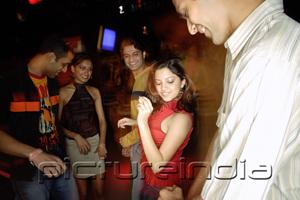 PictureIndia - Young adults dancing in night club
