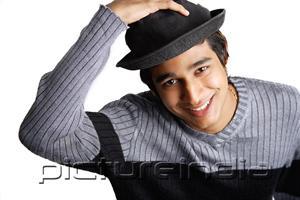 PictureIndia - Man wearing hat, smiling at camera