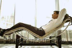 PictureIndia - Businessman reclining on chair