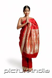 PictureIndia - Woman in traditional Indian costume, standing with hands together