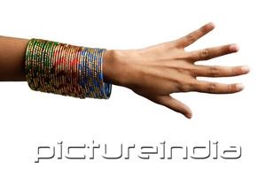 PictureIndia - Woman's hand with many bangles on her wrist