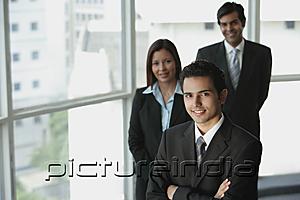PictureIndia - Businesspeople looking at camera, smiling